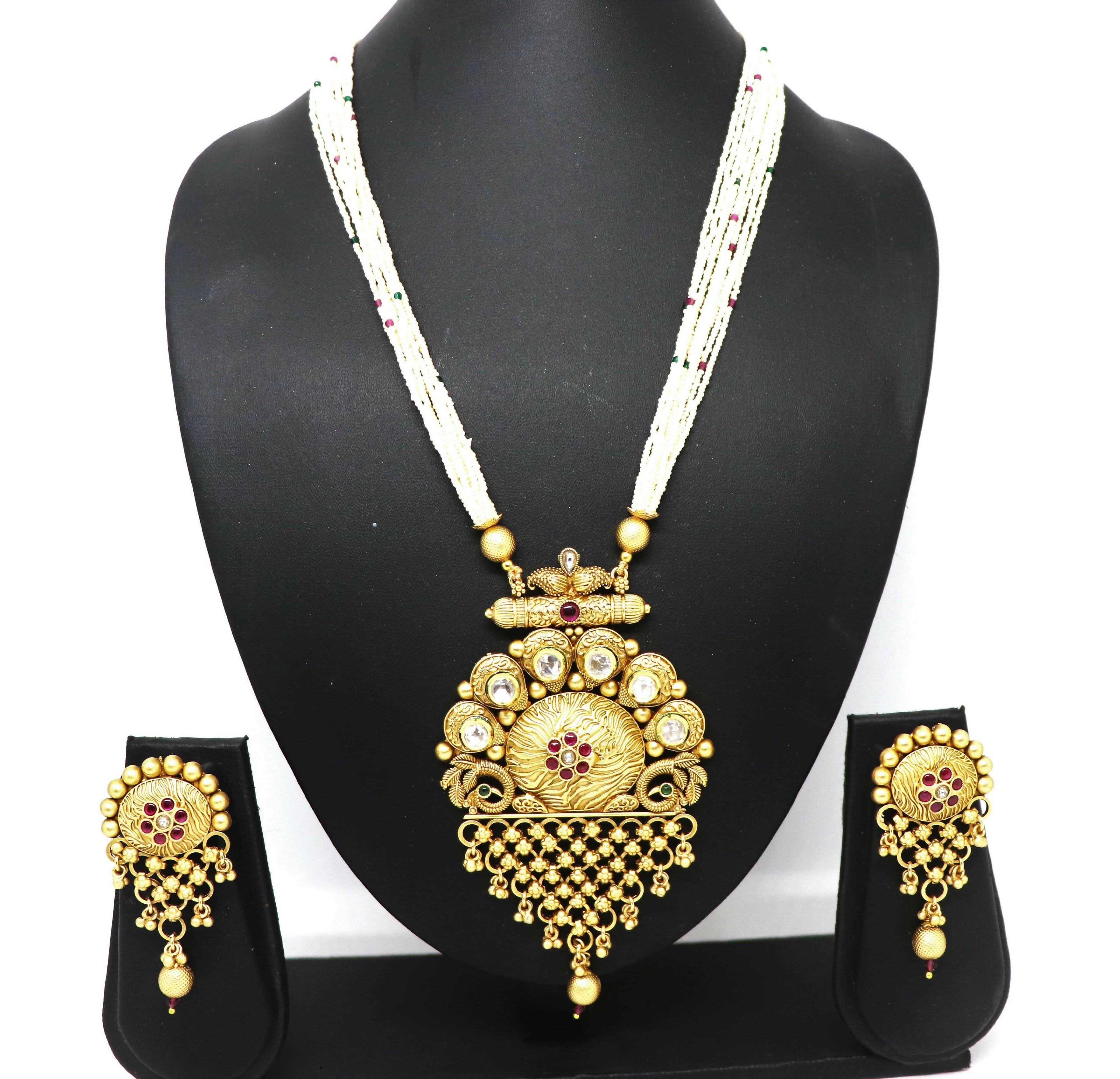 White stone Rajwadi polish necklace set featuring traditional brass craftsmanship.