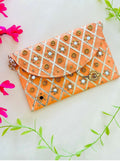 Vibrant orange structured clutch bag with magnetic closure