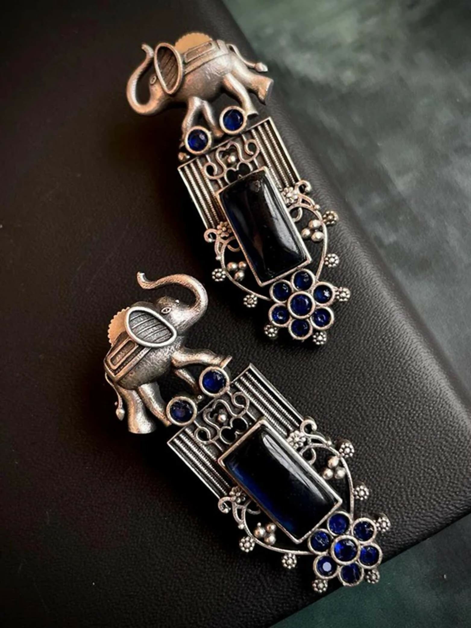 Oxidized brass elephant stud earrings with blue detailing