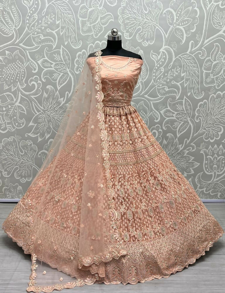 Peach heavy net wedding lehenga with dori, multi-thread, and rainbow sequins