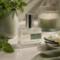 Roma Divine 30mL Extrait de Parfum in a clear glass bottle with silver accents.