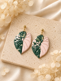 Pink Alocasia Serendipity leaf-shaped earrings made from polymer clay