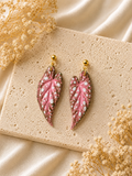 Detailed pink Begonia Maculata leaf earrings with hand-painted accents