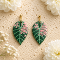 Pink Alocasia Watsoniana leaf earrings handcrafted from polymer clay.