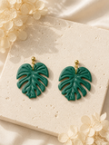 Monstera Deliciosa leaf-shaped polymer clay earrings in green and gold