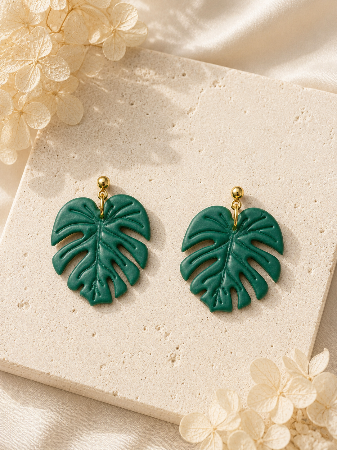 Monstera Deliciosa leaf-shaped polymer clay earrings in green and gold
