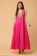 A stunning pink sleeveless Anarkali dress with a flowing silhouette and traditional design.