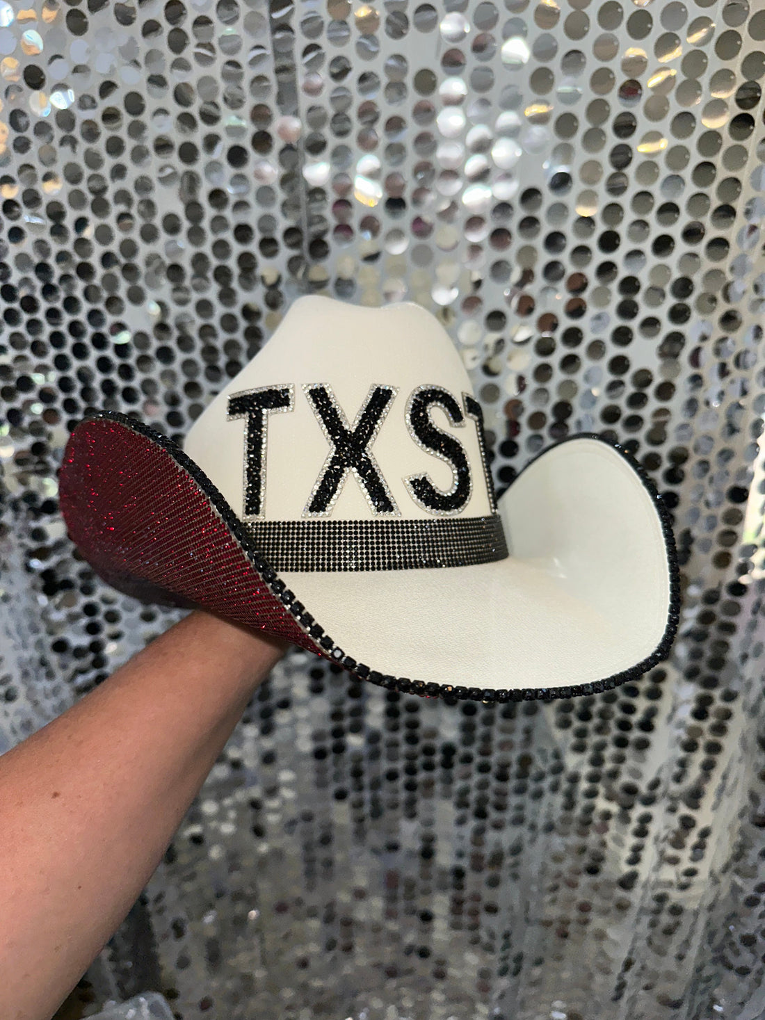 Texas State University branded hat in white, maroon, and black