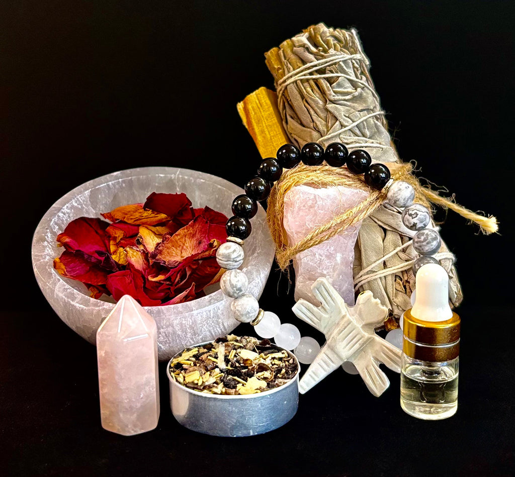 Post-Breakup Energy Ritual Kit featuring a triple protection crystal bracelet, sage bundle, rose petals, and essential oils.