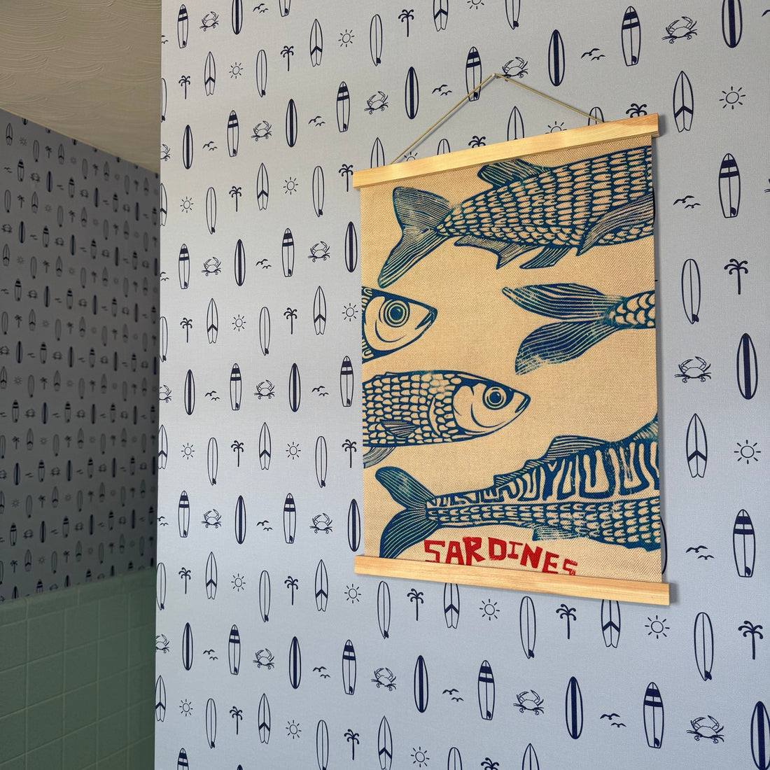 Surfs Up nautical wallpaper in light-blue and navy-blue for a coastal themed child's room.