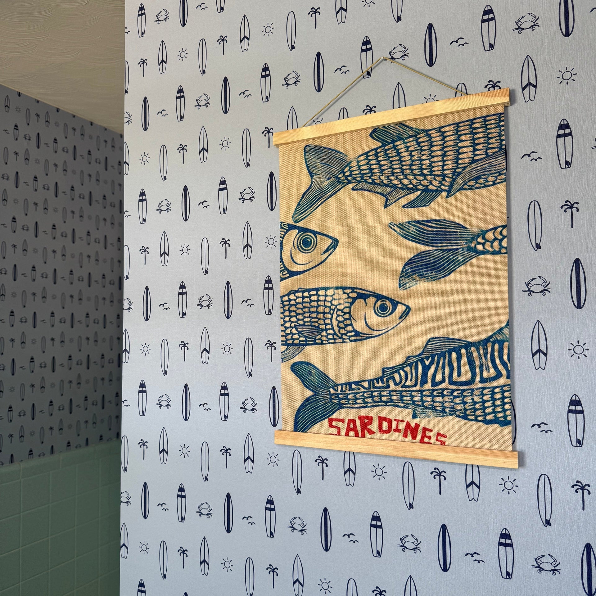 Surfs Up nautical wallpaper in light-blue and navy-blue for a coastal themed child's room.