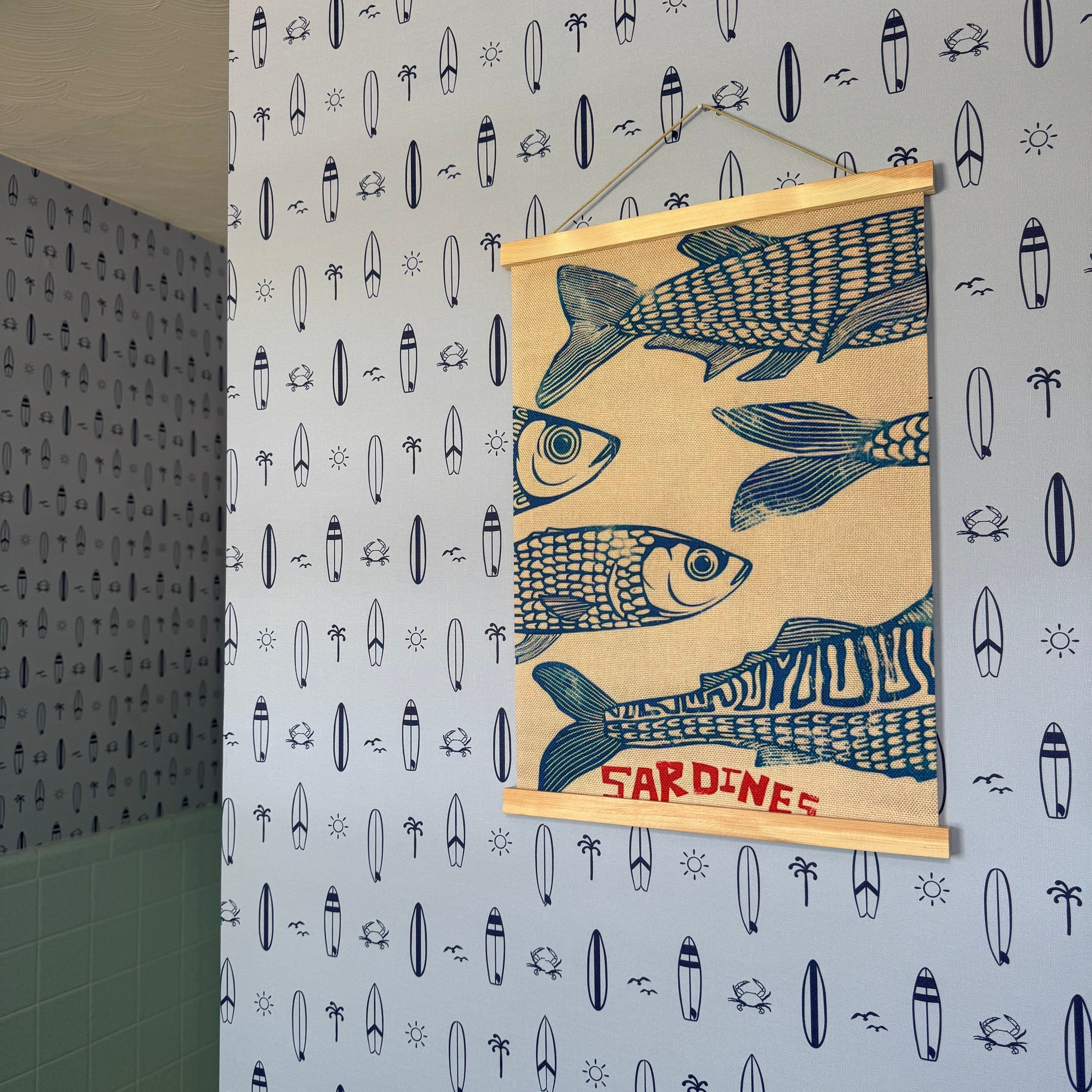 Surfs Up nautical wallpaper in light-blue and navy-blue for a coastal themed child's room.