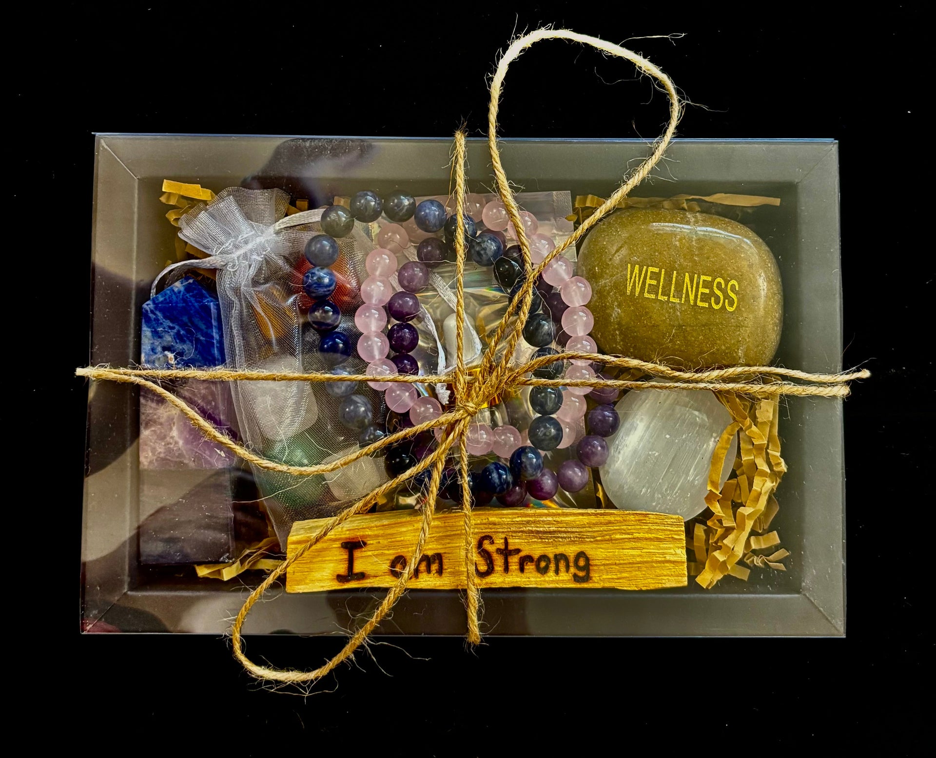 Anxiety Relief Healing Gift Box with crystals, essential oils, and stones in a neutral, bohemian-style arrangement.