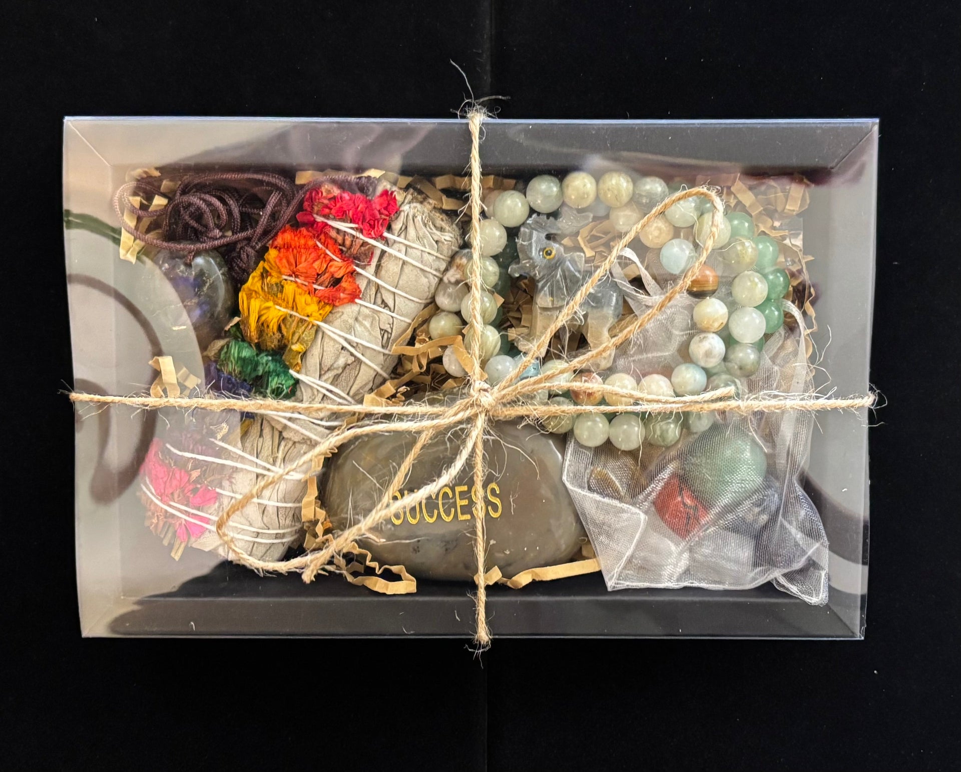 Reiki-infused bohemian gift box for graduates featuring green and brown natural elements