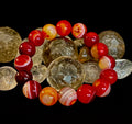 Fiery Spirit Red Banded Agate stretch bracelet featuring vibrant red and white swirling stone patterns.