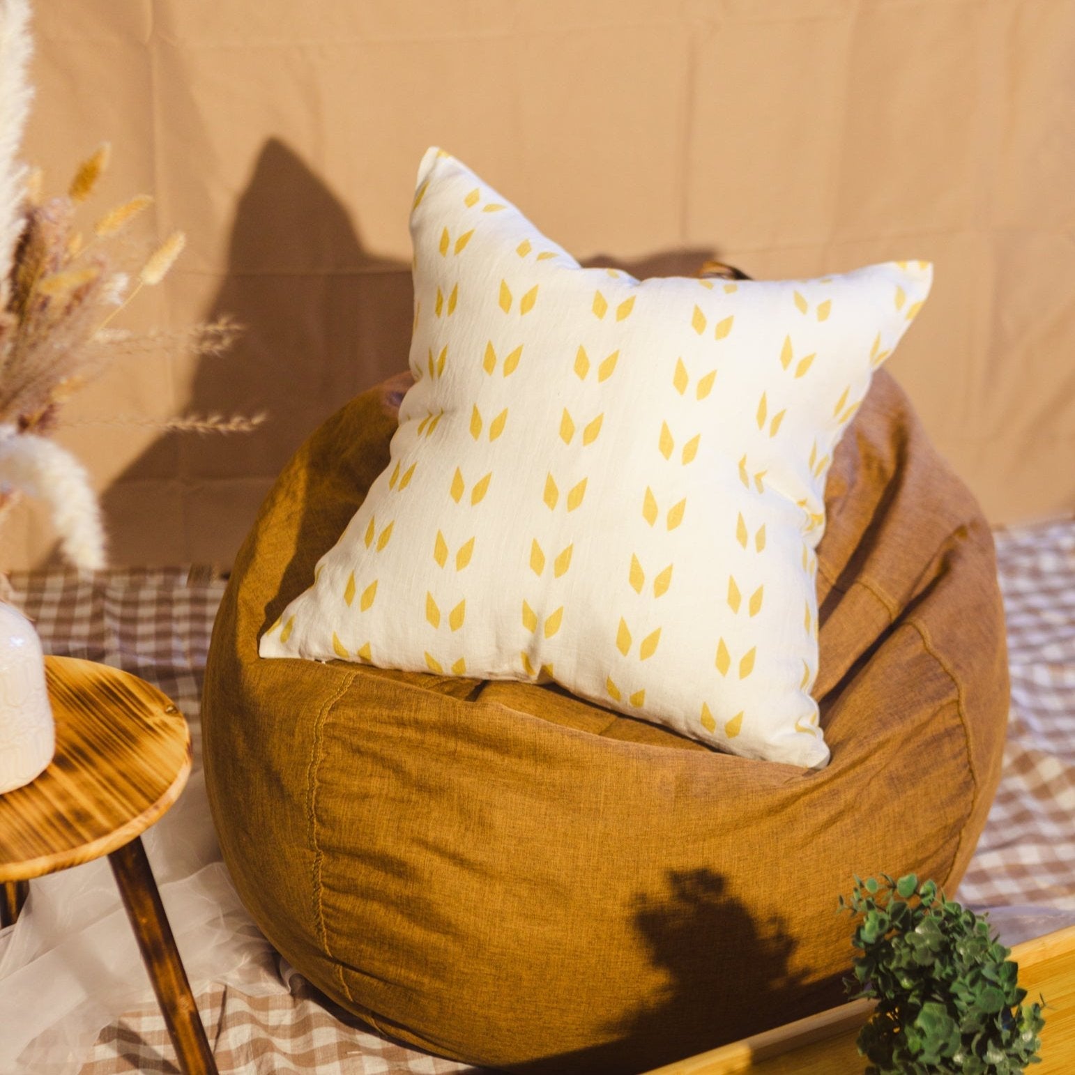 Terra throw pillow cover featuring a white and mustard geometric screen print on linen fabric.