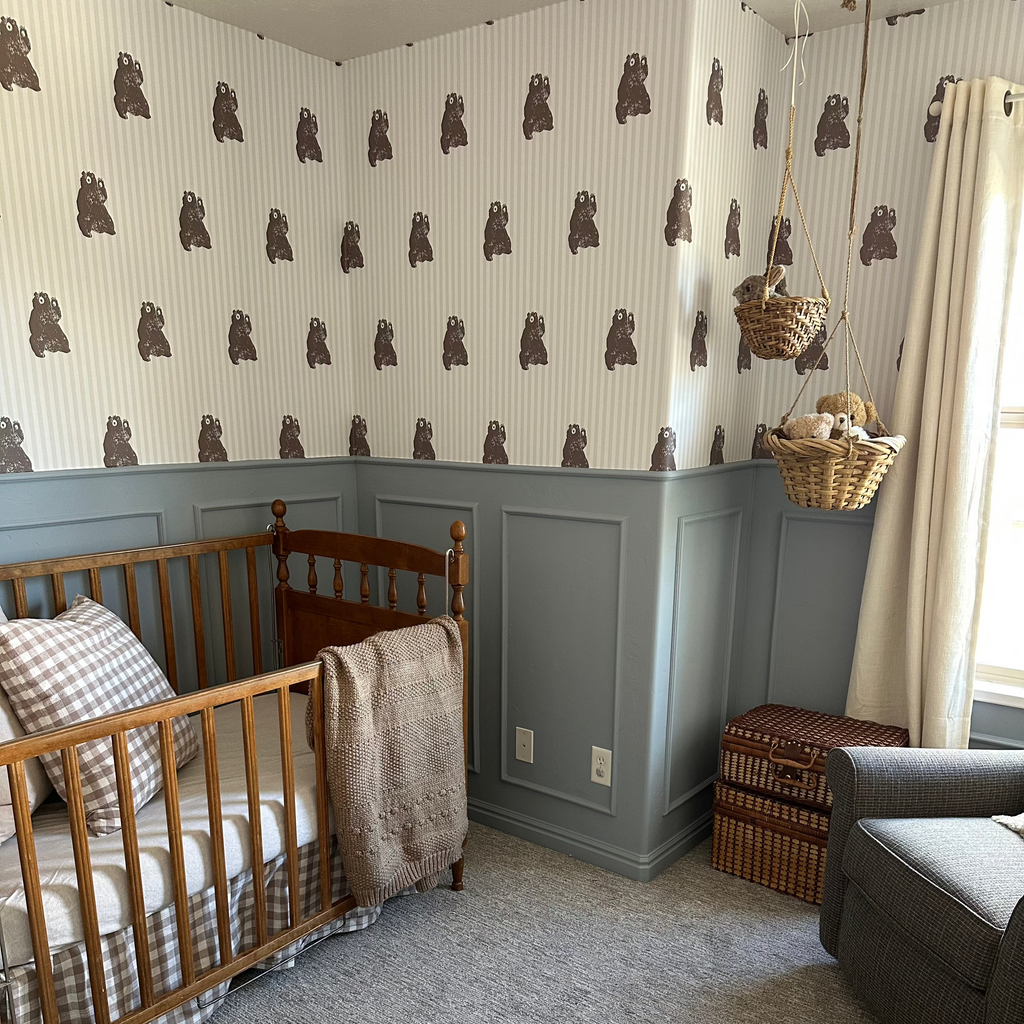 Whimsical Theodore animal print wallpaper featuring earthy brown designs on a white background.