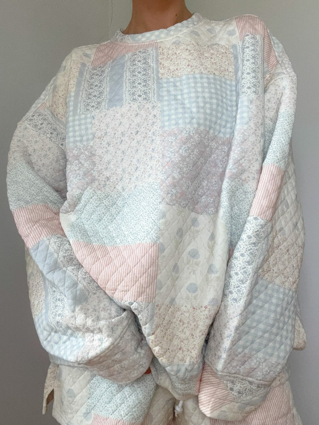 Shades of Blue Quilted Pastel Sweatshirt with a textured design and comfortable unisex fit.