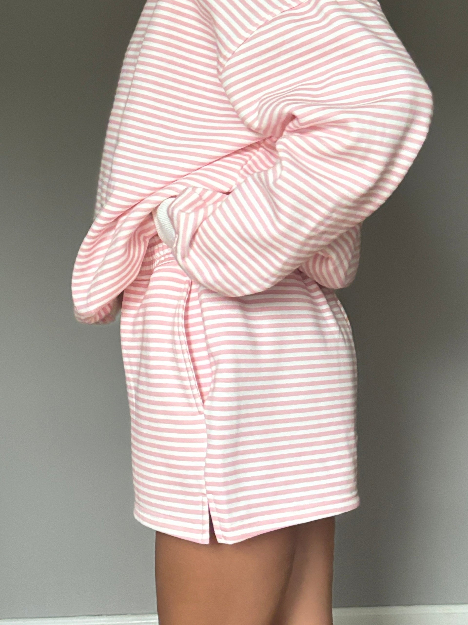 Light Pink and White Big Striped unisex shorts worn for a casual summer look