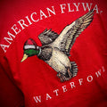 Festive holiday t-shirt featuring a graphic of a duck wearing a Santa hat