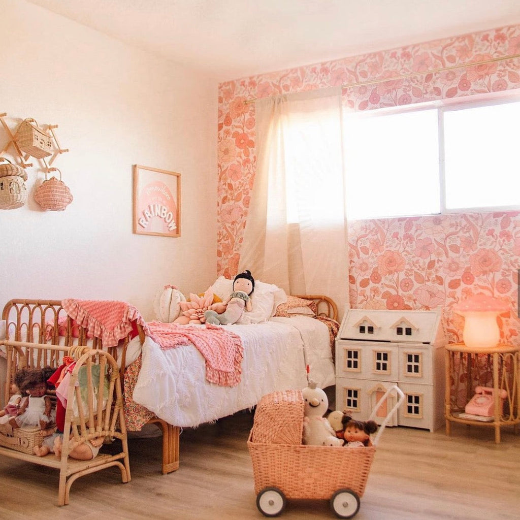 Betsy floral wallpaper in pink, peach, and cream with a vintage cottagecore vibe.