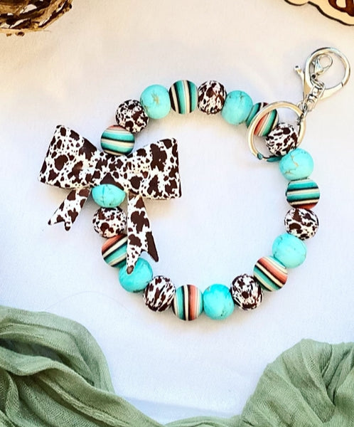 Western Brown Cowprint Bow Bead Wristlet