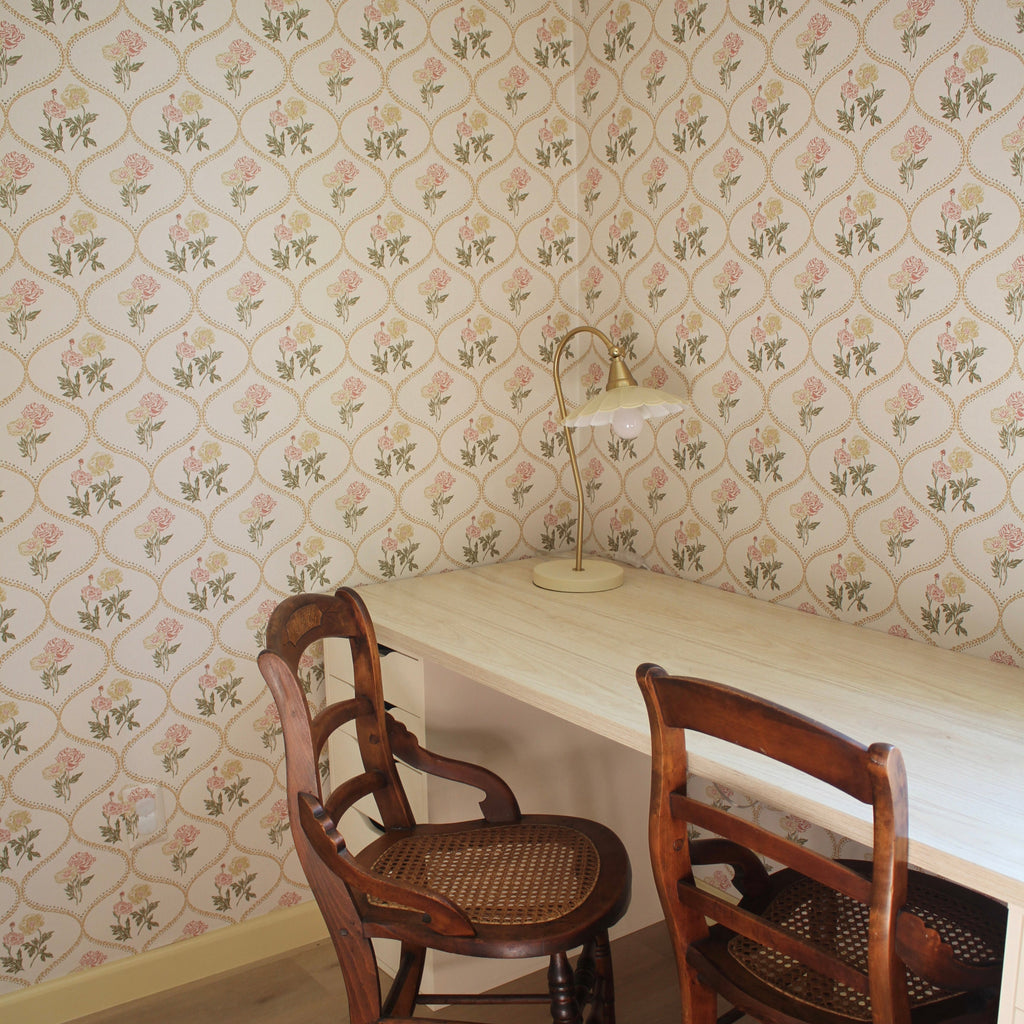 Avenly vintage floral wallpaper in sage-green and terracotta on an off-white background.