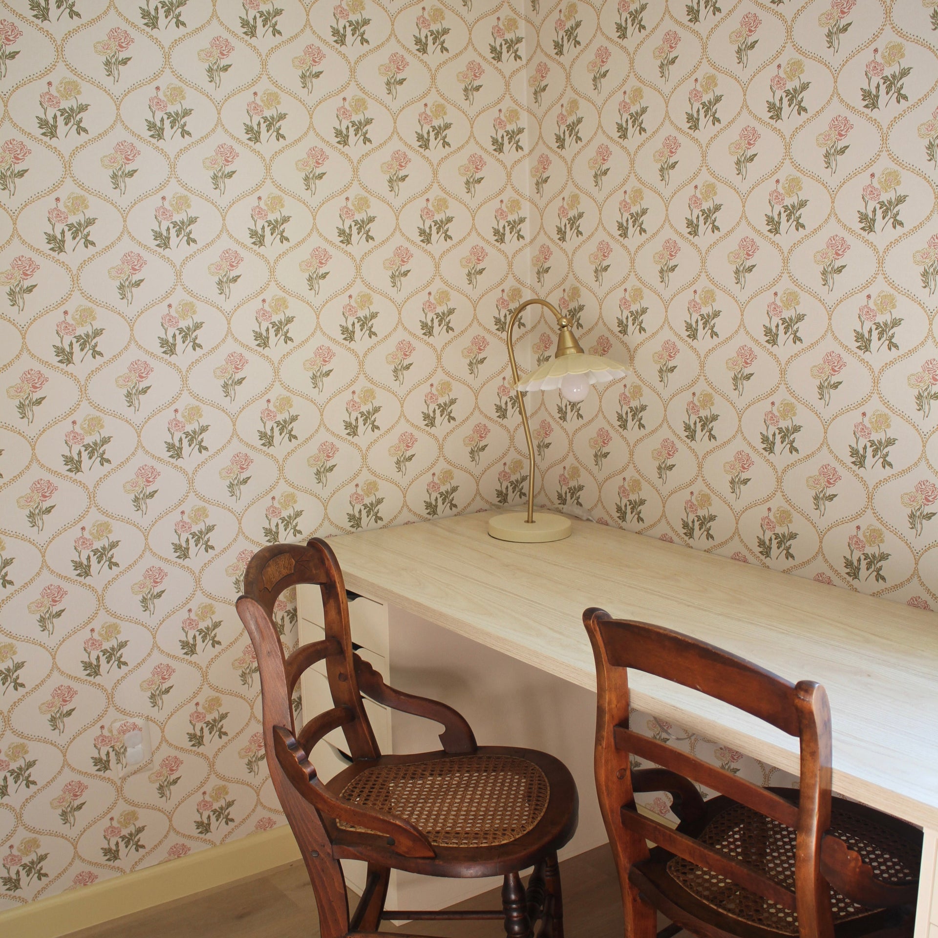 Avenly vintage floral wallpaper in sage-green and terracotta on an off-white background.