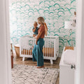 Green and white Clarence wallpaper featuring a modern bohemian floral-inspired pattern.
