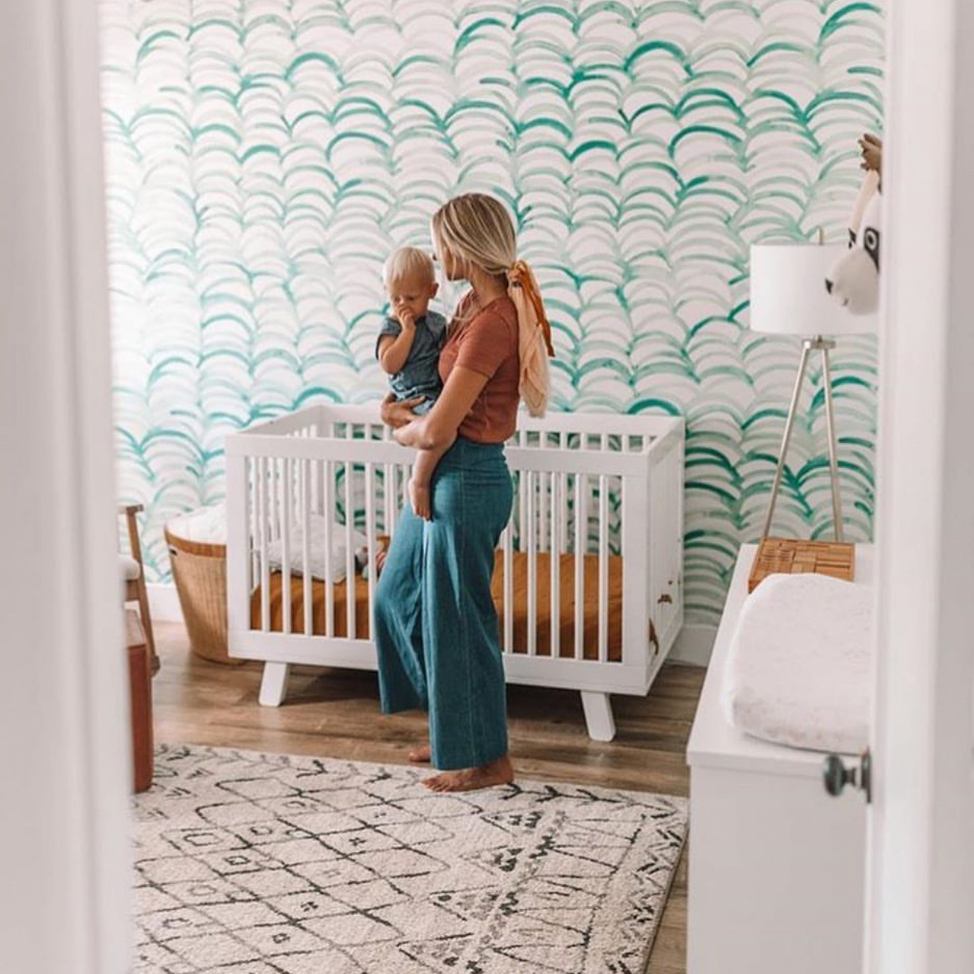 Green and white Clarence wallpaper featuring a modern bohemian floral-inspired pattern.
