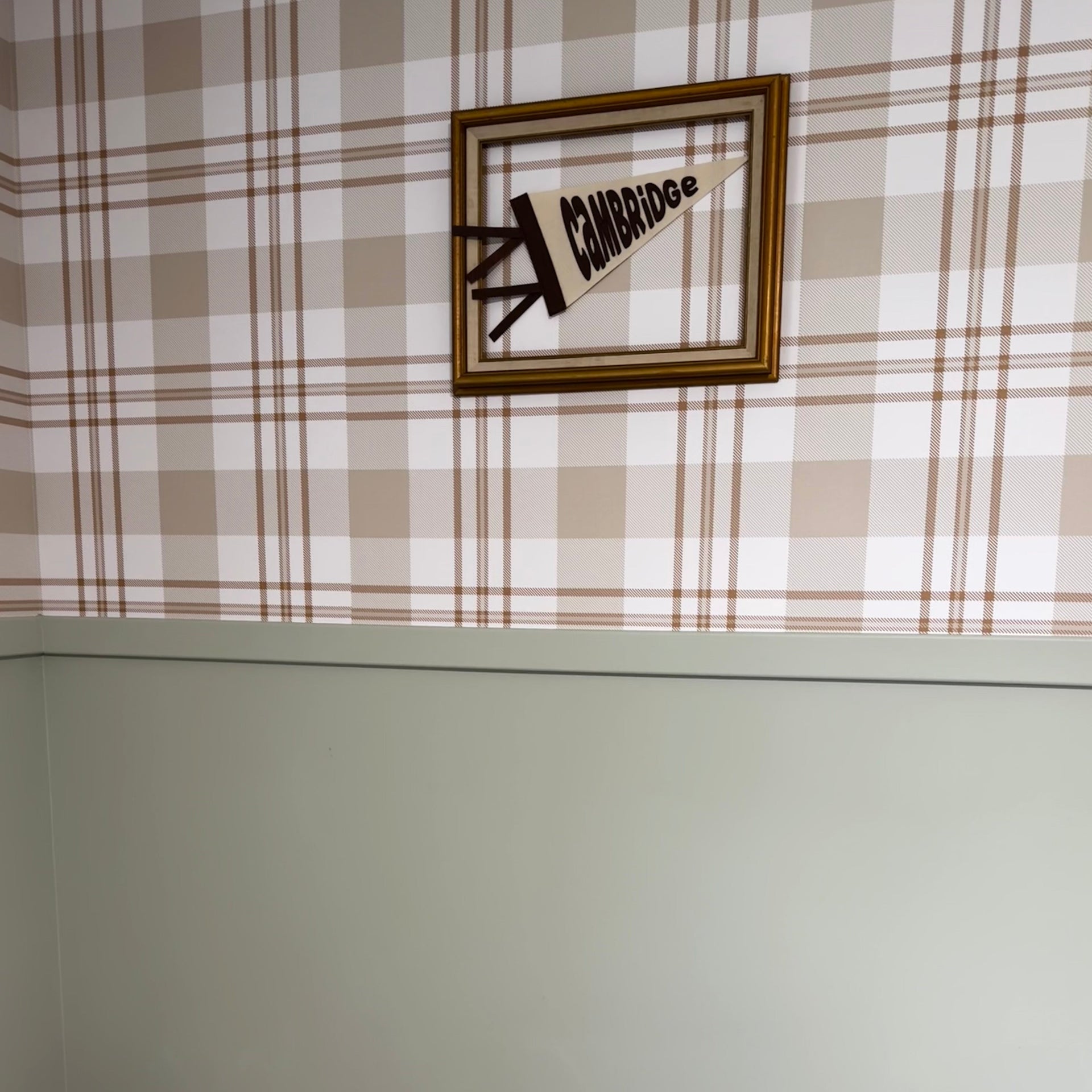 Archer plaid wallpaper in beige and cream on a clean minimalist wall