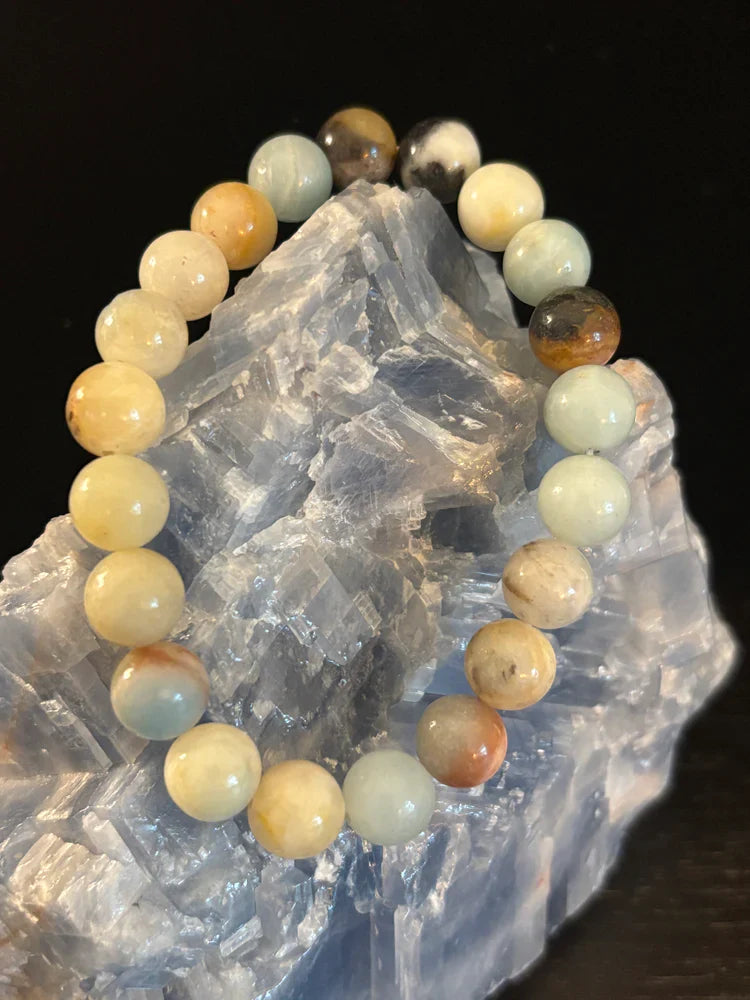 Close up of a bohemian unisex Nantasket Beach Amazonite beaded bracelet with seafoam blue and earthy cream tones.