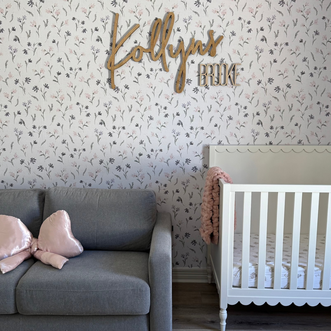 Mae floral wallpaper in white, pale-pink, and grey, featuring a boho minimalist pattern.