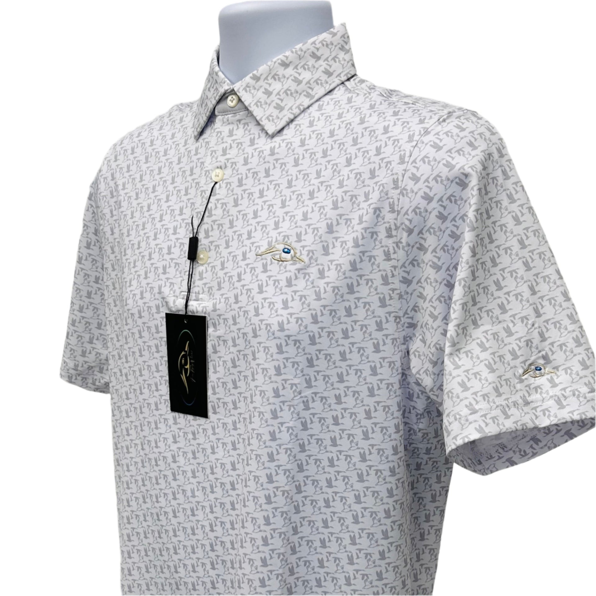 White polo shirt with grey flying duck pattern worn by a golfer on the course