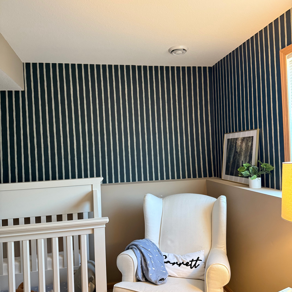 Close up of Drew striped wallpaper in dark teal, deep red, and off-white traditional farmhouse pattern.