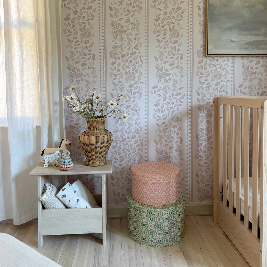 Bridget floral wallpaper featuring dusty-rose and pale-blue botanical art.