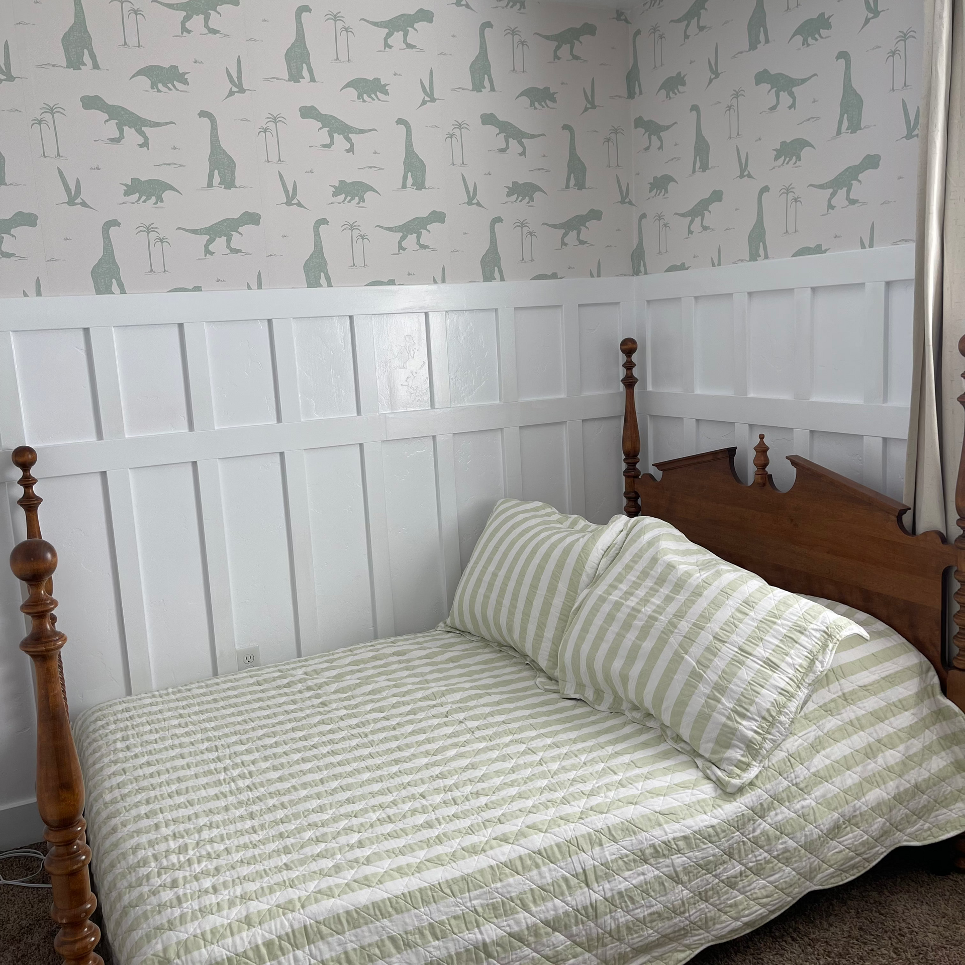Arlo whimsical wallpaper in sage-green and off-white, perfect for nursery walls.
