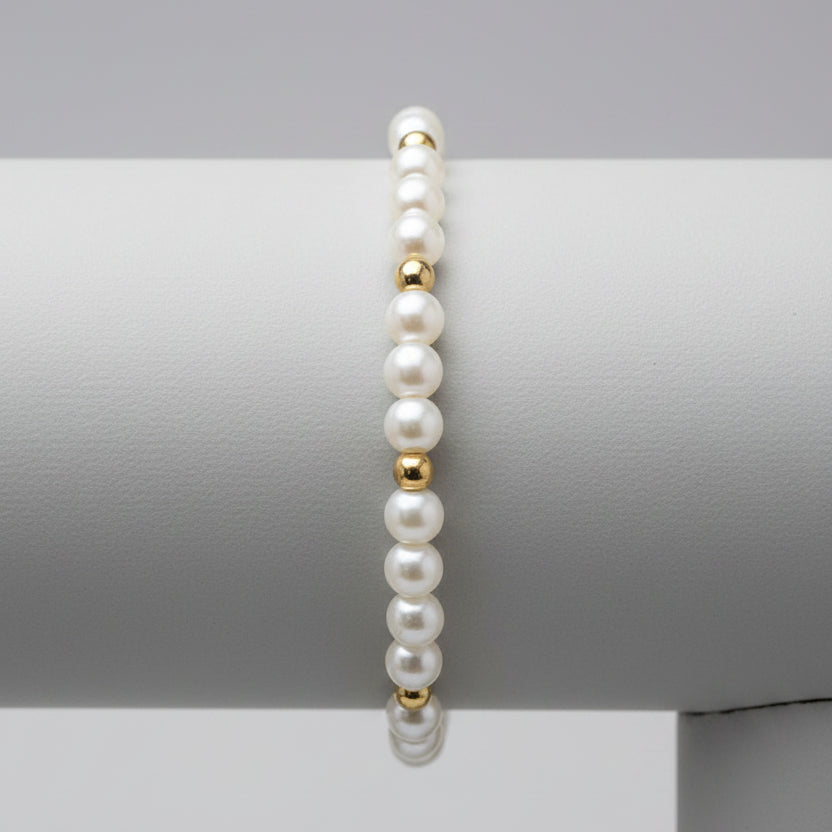 Miss Radiance bracelet featuring white pearls and 14K gold-filled beads on a neutral background