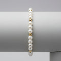 Miss Radiance bracelet featuring white pearls and 14K gold-filled beads on a neutral background