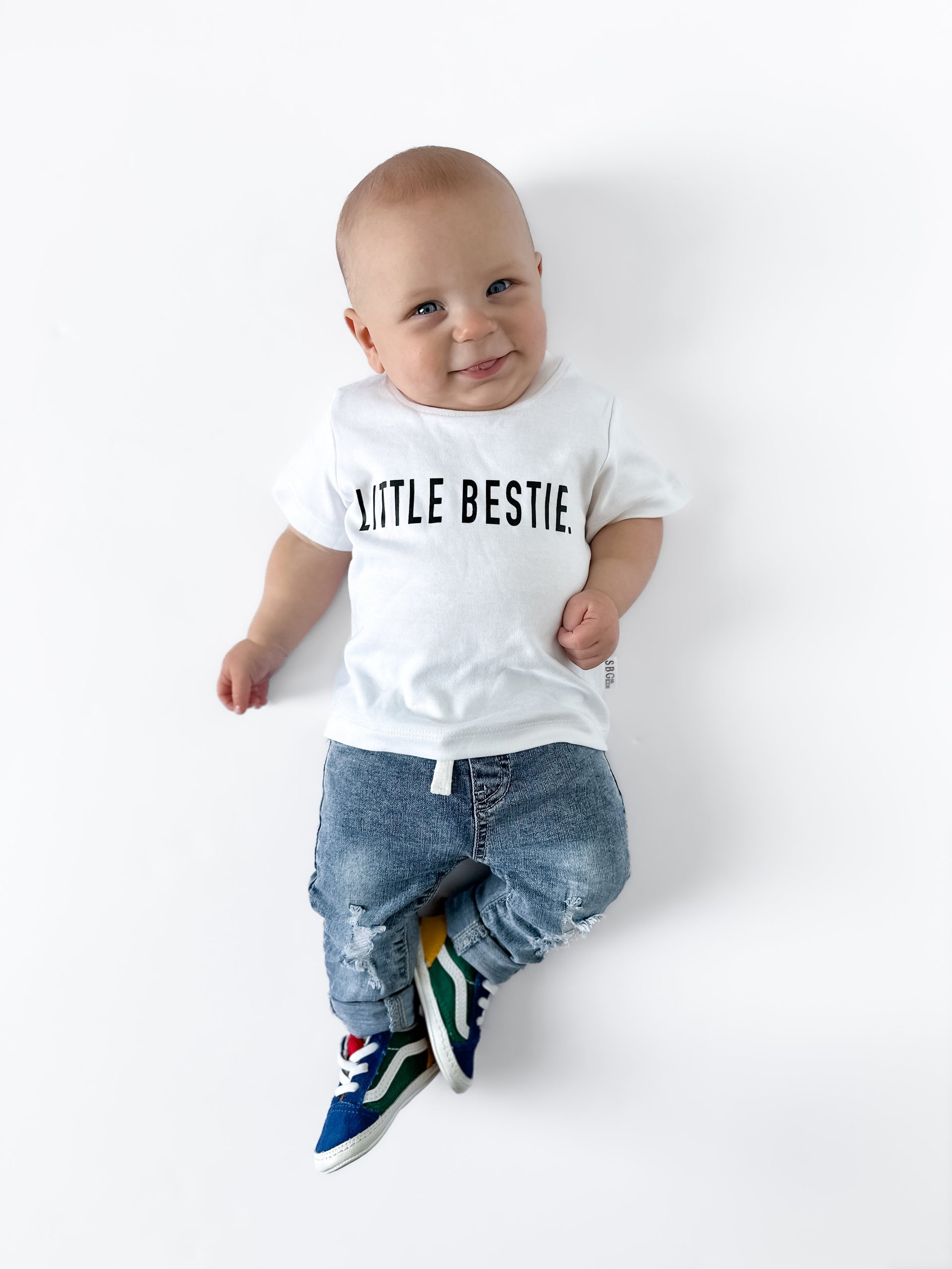 Child wearing a Little Bestie graphic t-shirt with a soft, lived-in texture