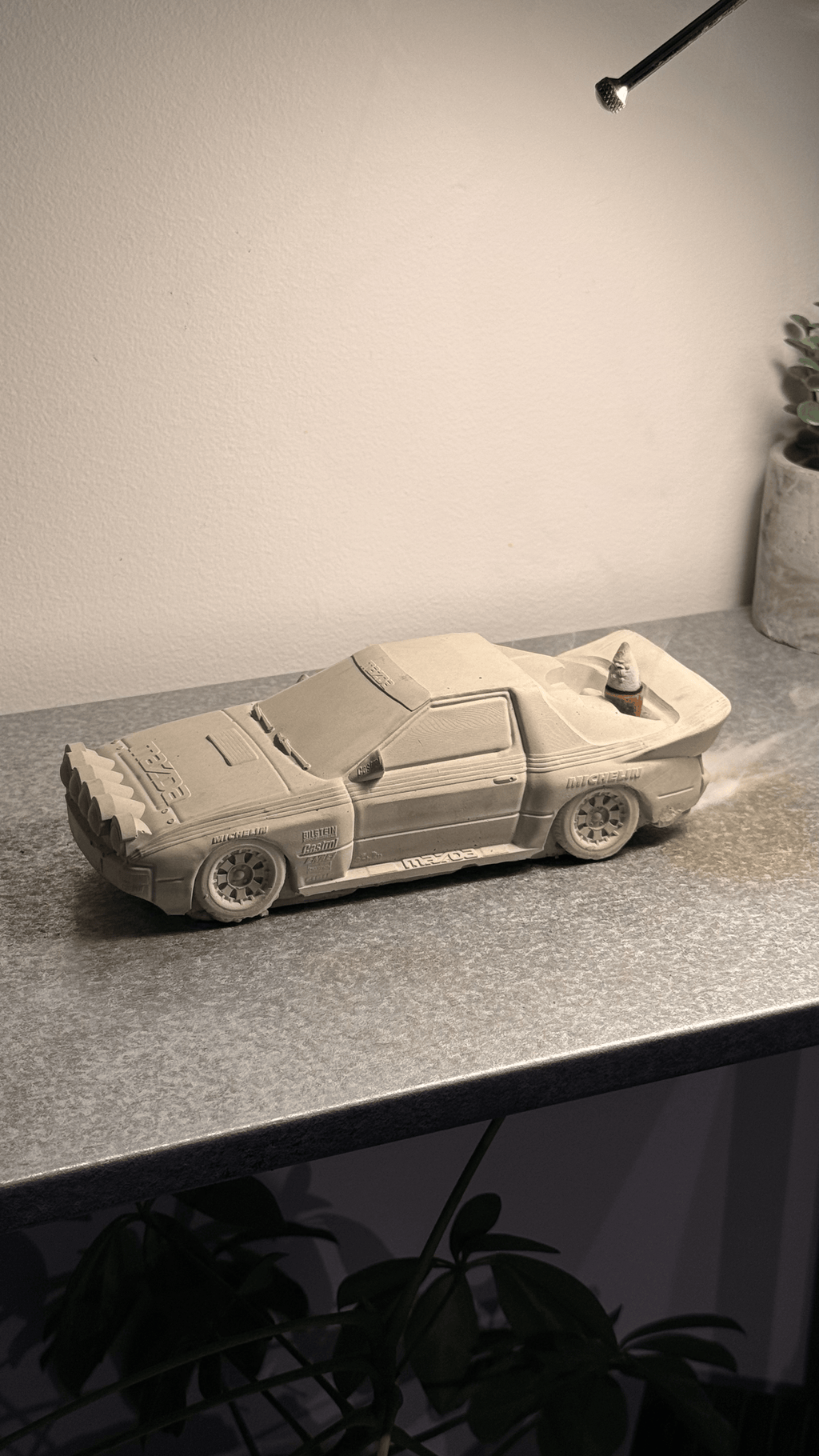 Grey concrete Rally RX-7 backflow incense burner with exhaust pipe design