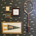Trout animal print wallpaper in dark-green, off-white, and brown for a rustic, nautical aesthetic.