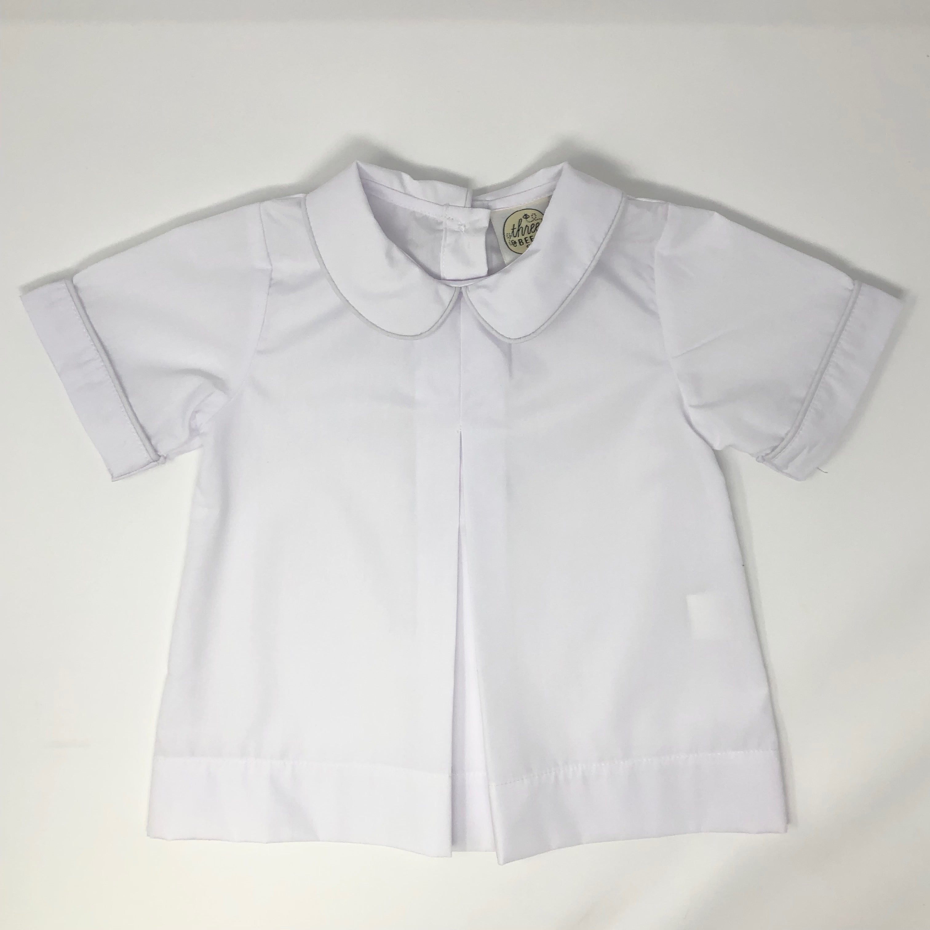 White short sleeve button-up shirt for boys with a Peter Pan collar and center pleat detail