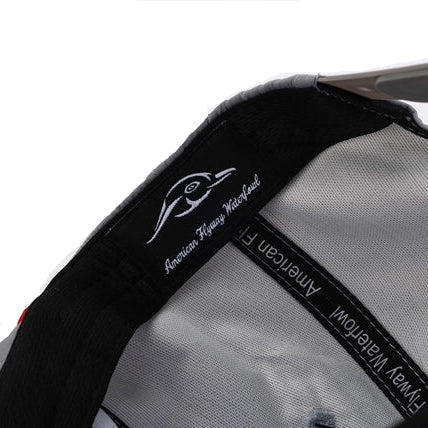 Close-up of a gray bag with black accents and 'American Way' branding on a white background