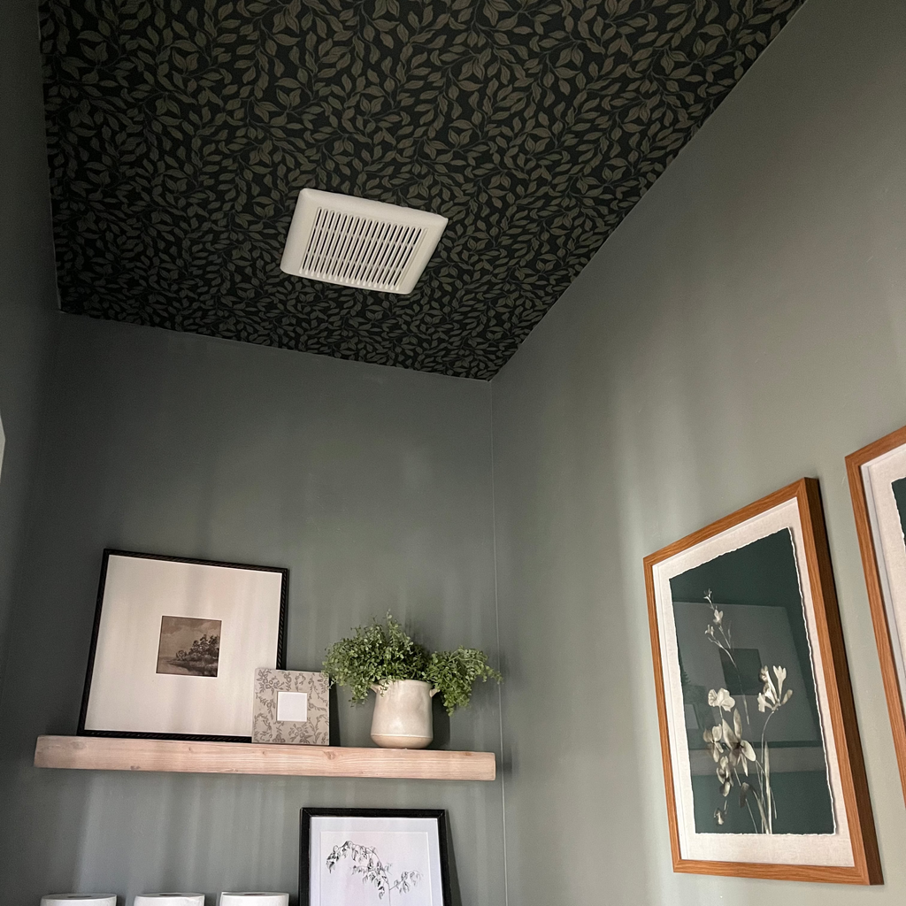 Waylon floral wallpaper in green, cream, and grey with a bohemian vibe.