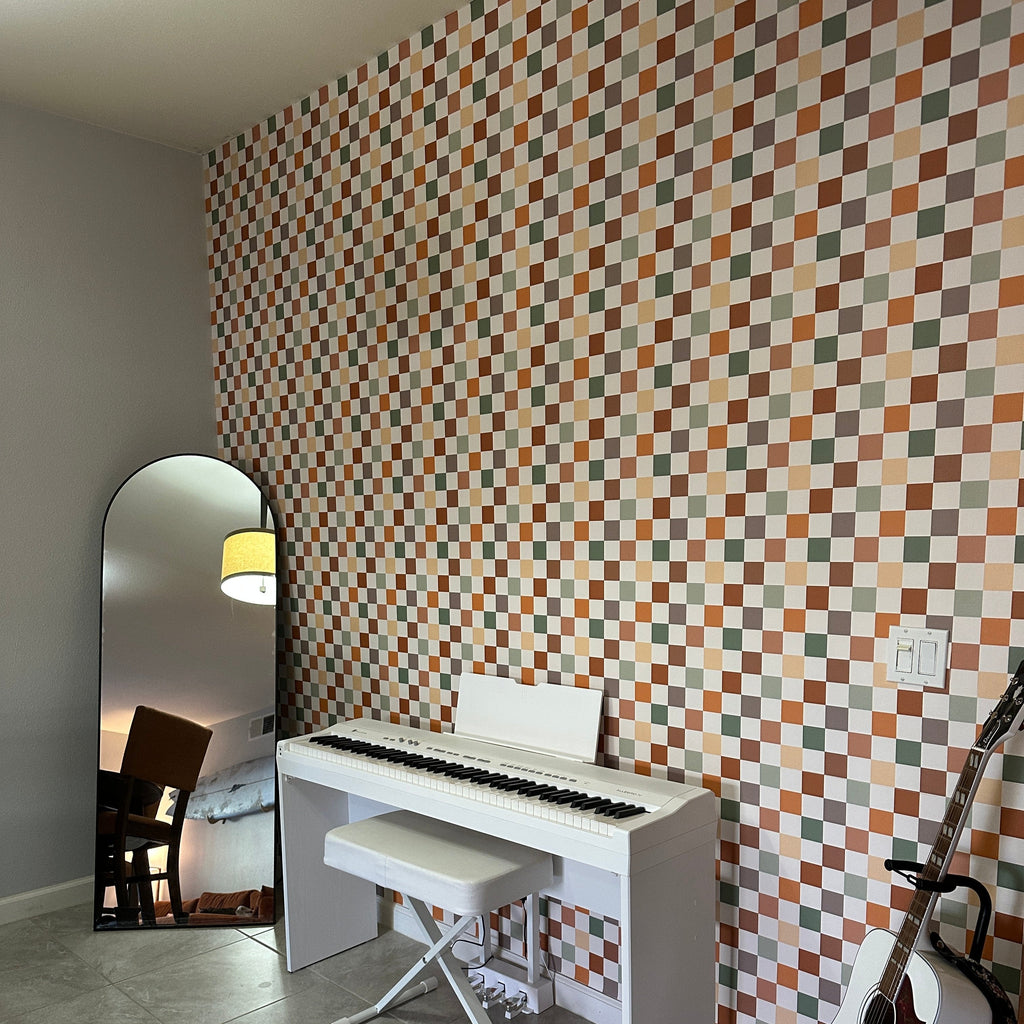 Close up of Beck geometric wallpaper in terracotta, sage-green, cream, and taupe tones