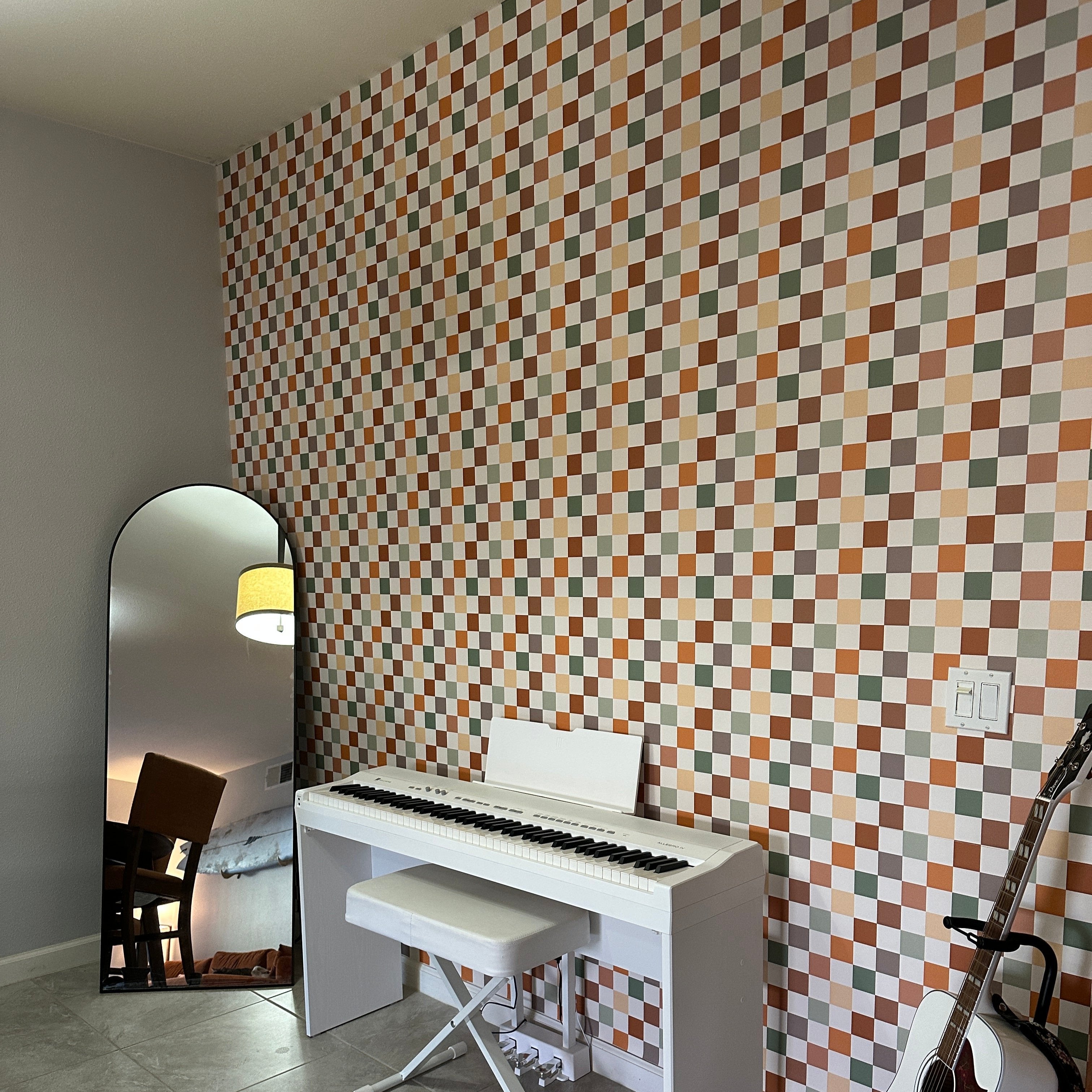 Close up of Beck geometric wallpaper in terracotta, sage-green, cream, and taupe tones