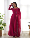 A front view of a vibrant pink Anarkali gown with a designer yoke, potli buttons, and matching pants.
