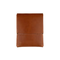 Minimalist brown full-grain leather Franklin wallet on a neutral surface