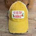 Mustard yellow distressed trucker hat with Ya Filthy Animal embroidered patch and tan mesh back.